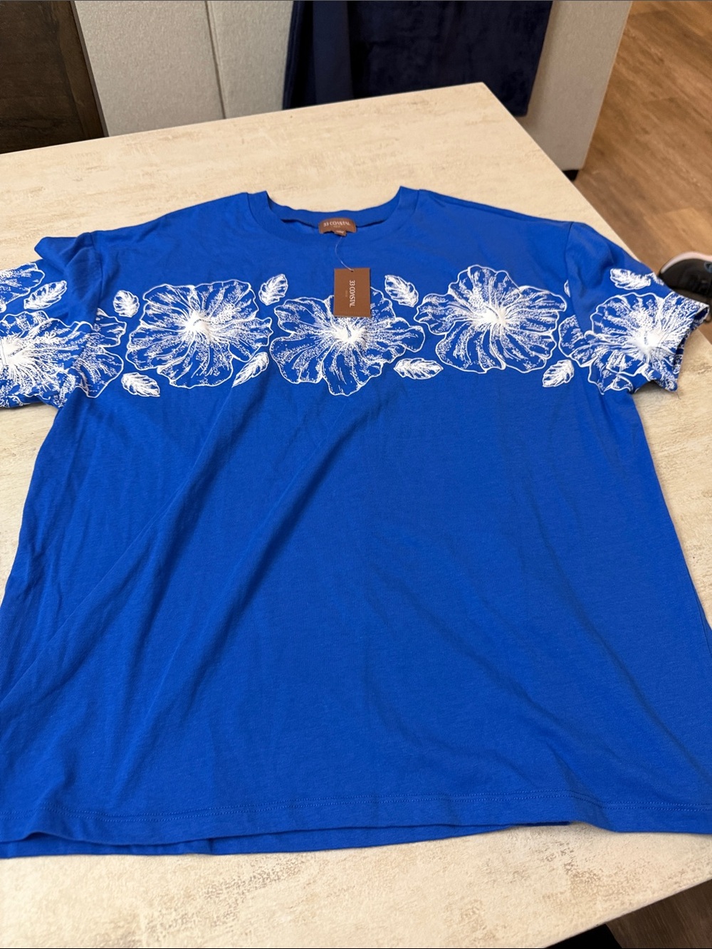 Buckle Blue Short Sleeve Crewneck Shirt with White Floral Print. 33 Coastal line